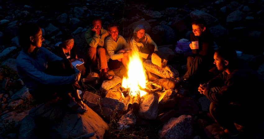 A group of campers around a campfire