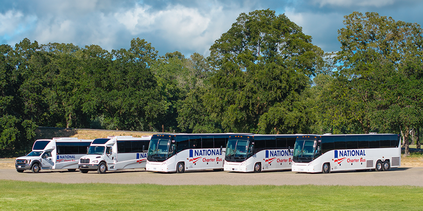 a fleet of parked buses with National branding