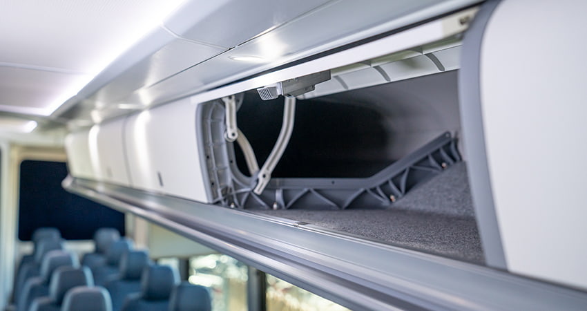 The overhead storage compartment on a charter bus