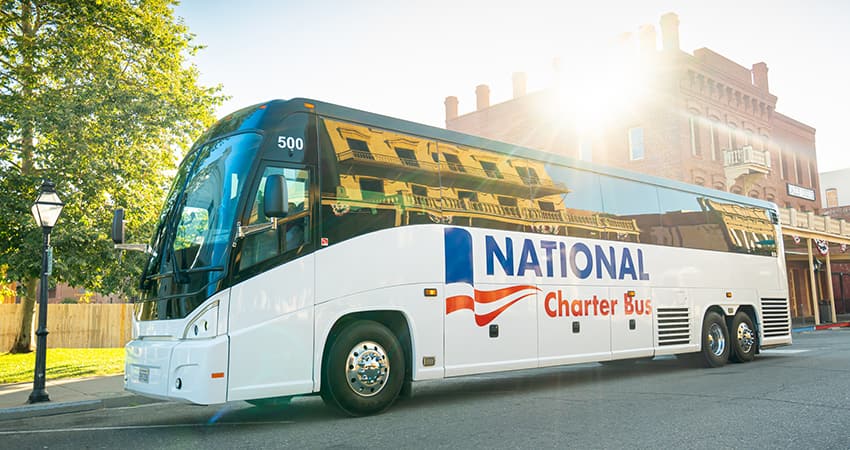 a parked charter bus with National Charter Bus branding