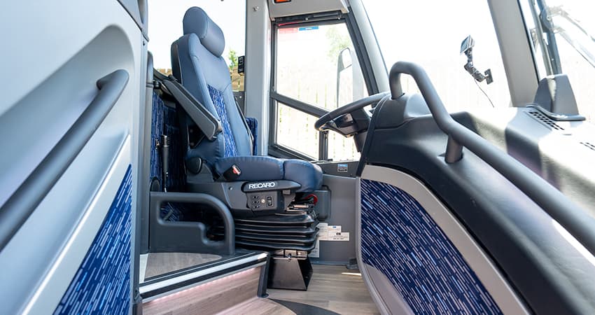 The driver seat of a charter bus