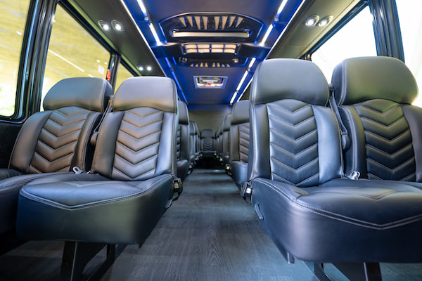 black leather seats inside a shuttle bus