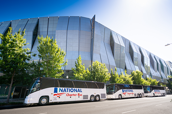 two charter buses parked