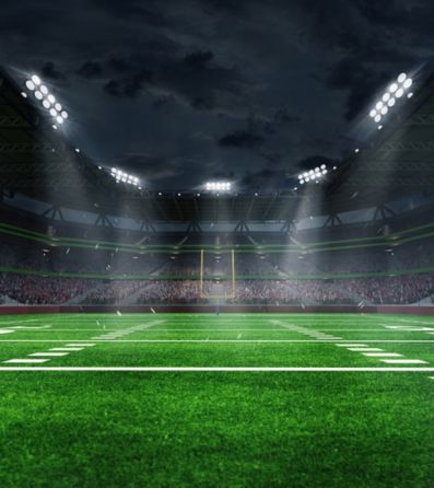 A football field lit up at night