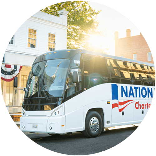 A charter bus parked on a city street