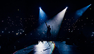 A singer addresses the crowd at a concert