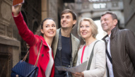 a group of tourists taking a selfie 