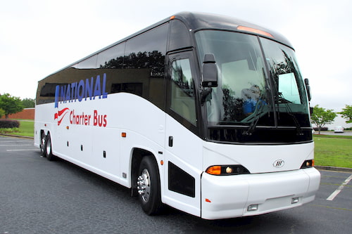 a white charter bus with the logo for national charter bus on the side