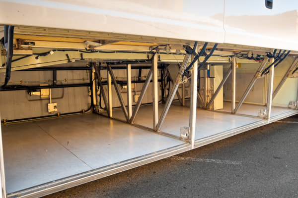 a spacious luggage bay under a charter bus