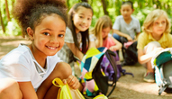 Children with backpacks on a field trip