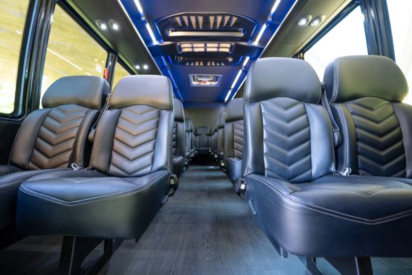 Interior of a shuttle bus with leather seats and LED lights